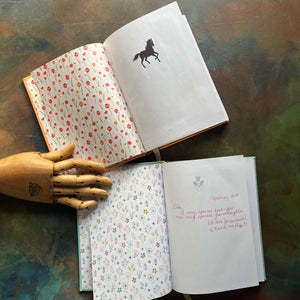 Pair of Barnes & Noble Leather-Bound Editions-Black Beauty by Anna Sewell-The Secret Garden-Frances Hodgson Burnett-classic children's literature-view of the half title pages