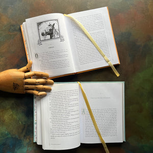 Pair of Barnes & Noble Leather-Bound Editions-Black Beauty by Anna Sewell-The Secret Garden-Frances Hodgson Burnett-classic children's literature-view of the inside content showing the silk page ribbons