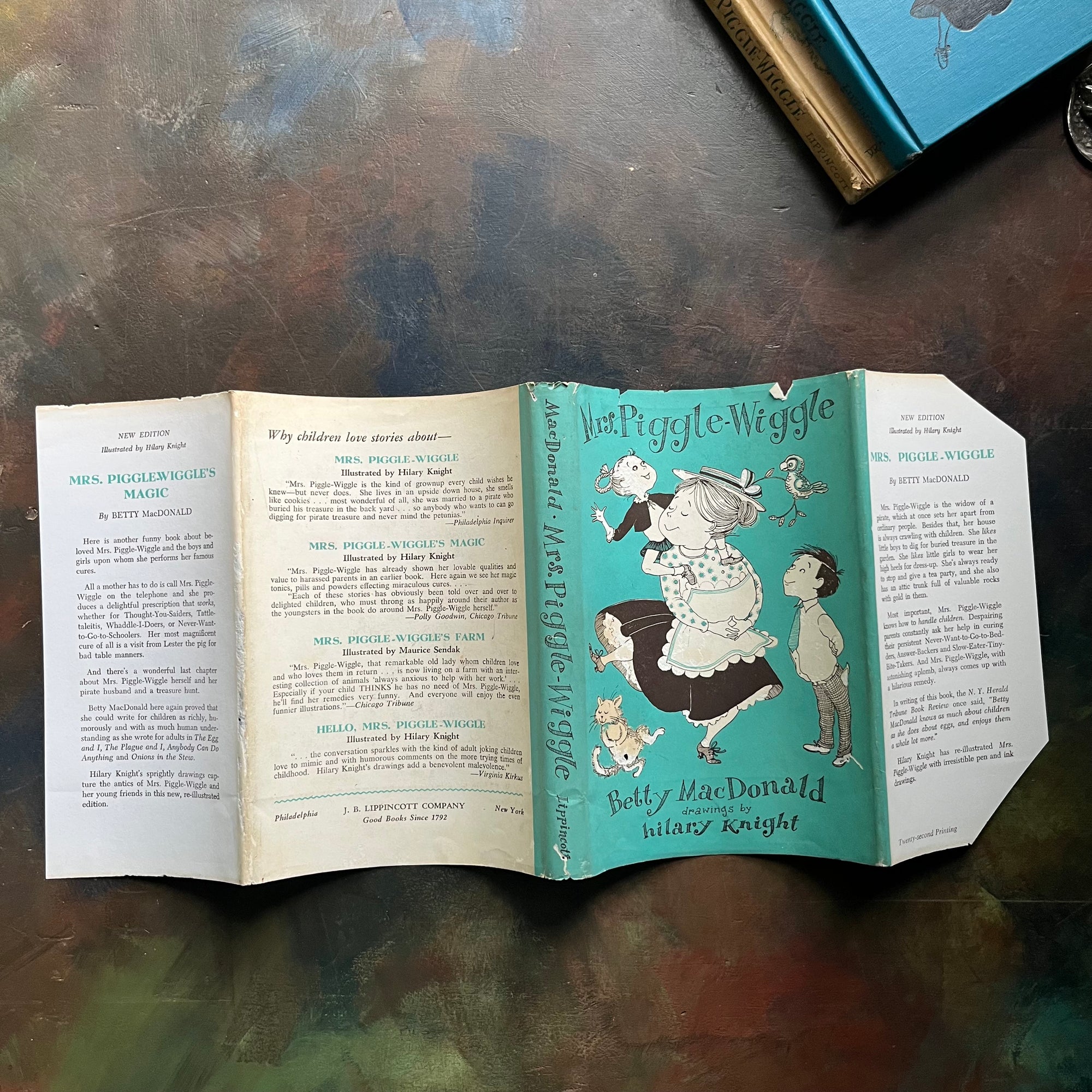 Pair of Betty MacDonald Books-Mrs. Piggle-Wiggle and Hello, Mrs. Piggle-Wiggle-illustrated by Hilary Knight-family read aloud classic children's books-vintage chapter books-humorous children's books-view of the complete dust jacket of Mrs. Piggle-Wiggle