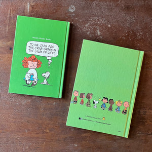  vintage children's picture books/cartoon books - Pair of vintage children's cartoon books written & illustrated by Charles M. Schulz Books for Children:  It's a Dog's Life, Charlie Brown & It's a Mystery, Charlie Brown - view of the back covers