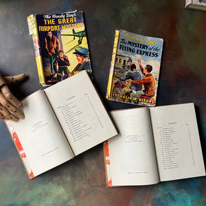 Pair of Hardy Boys Mysteries written by Franklin W. Dixon-The Great Airport Mystery-The Mystery of the Flying Express-vintage children's mysteries-view of the copyright & contents pages