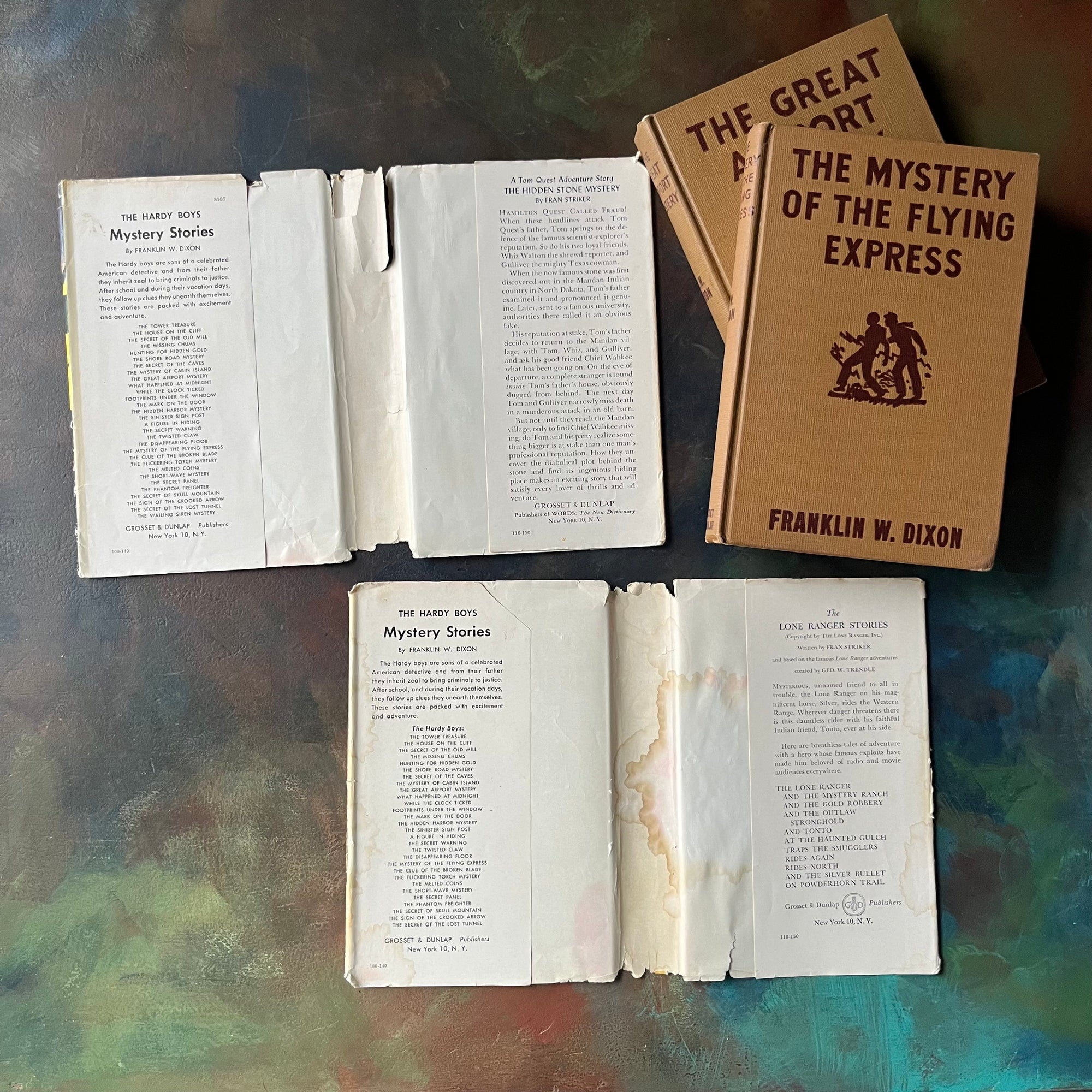Pair of Hardy Boys Mysteries written by Franklin W. Dixon-The Great Airport Mystery-The Mystery of the Flying Express-vintage children's mysteries-view of the dust jacket's inside flaps