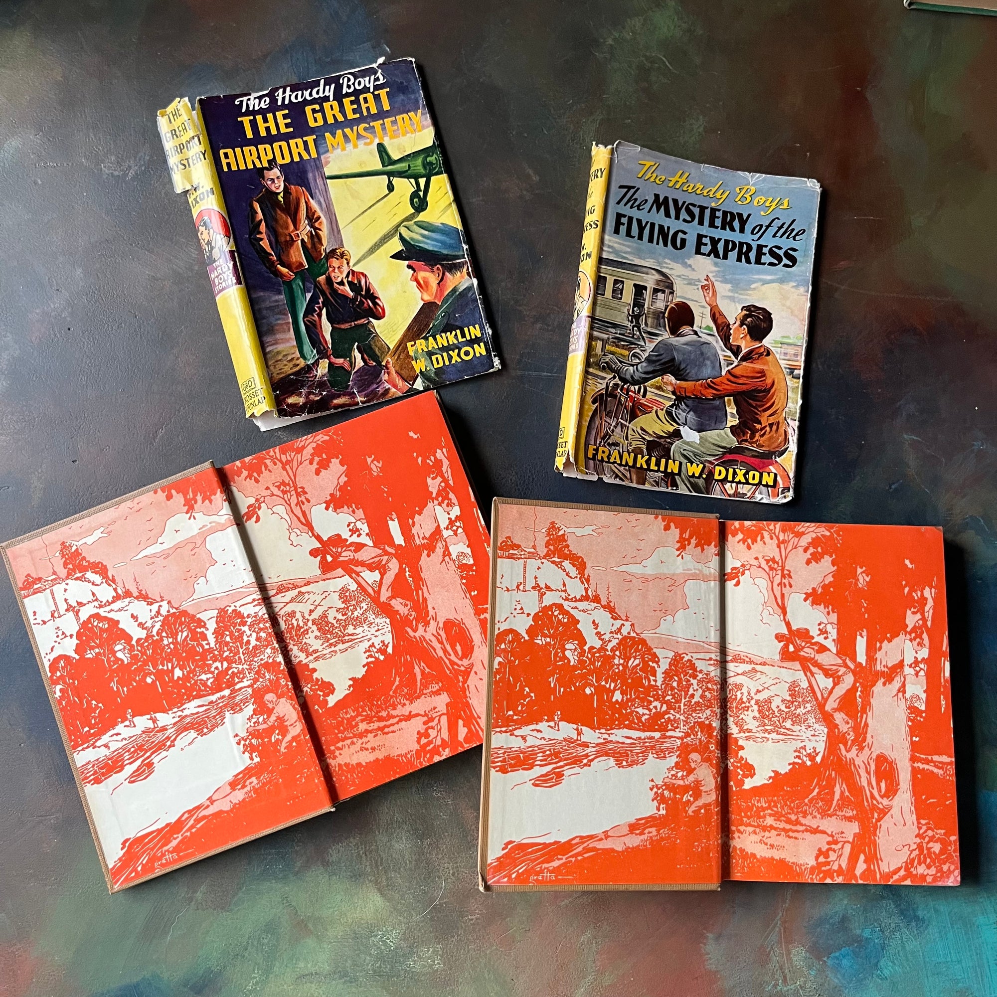 Pair of Hardy Boys Mysteries written by Franklin W. Dixon-The Great Airport Mystery-The Mystery of the Flying Express-vintage children's mysteries-view of the inside covers