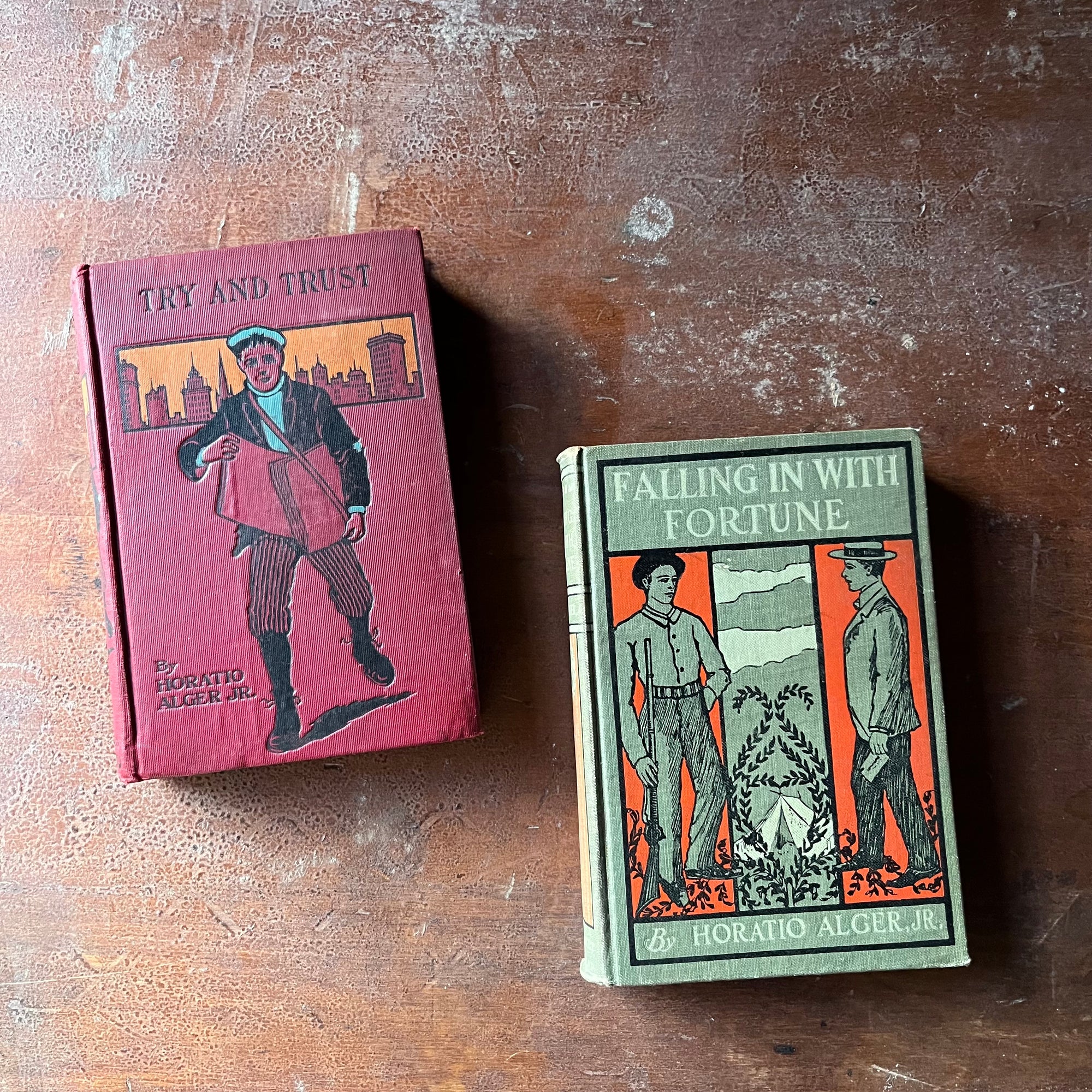 Pair of vintage children's chapter books written by Horatio Alger, Jr.:  Try & Trust & Falling in with Fortune - view of the embossed front covers