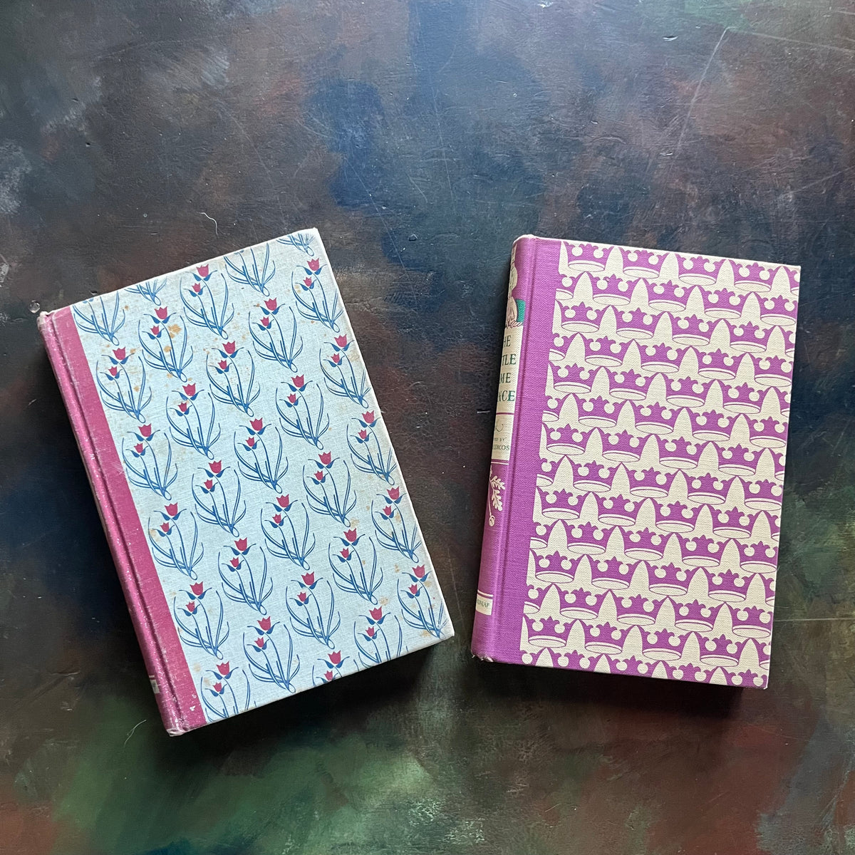 Pair of Illustrated Junior Library Editions Books-Little Lame Prince and the Story of a Brownie and Hans Brinker or the Silver Skates-collectible children's classics-view of the front covers with a repeating design representing each story a crown and flowers.