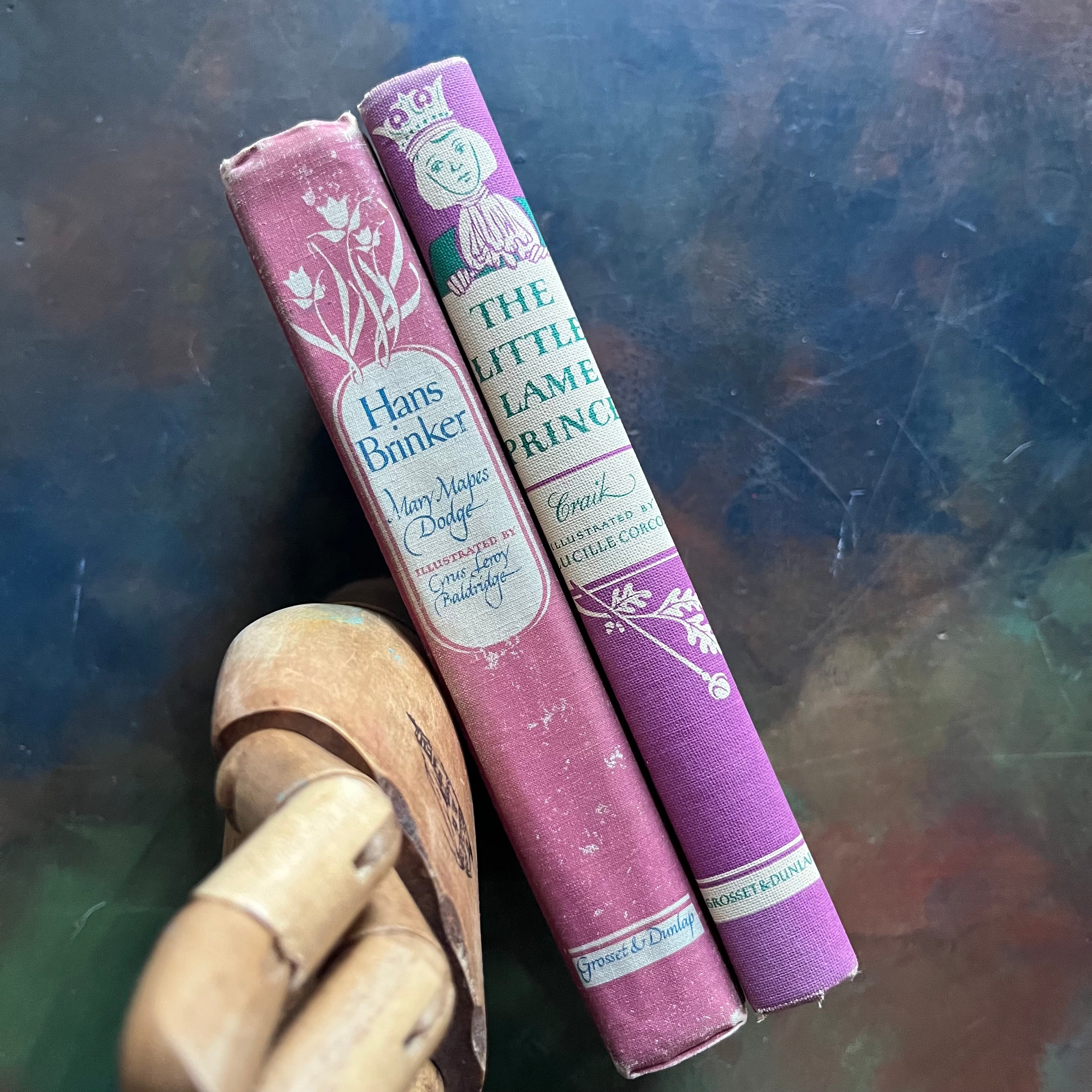 Pair of Illustrated Junior Library Editions Books-Little Lame Prince and the Story of a Brownie and Hans Brinker or the Silver Skates-collectible children's classics-view of the spines