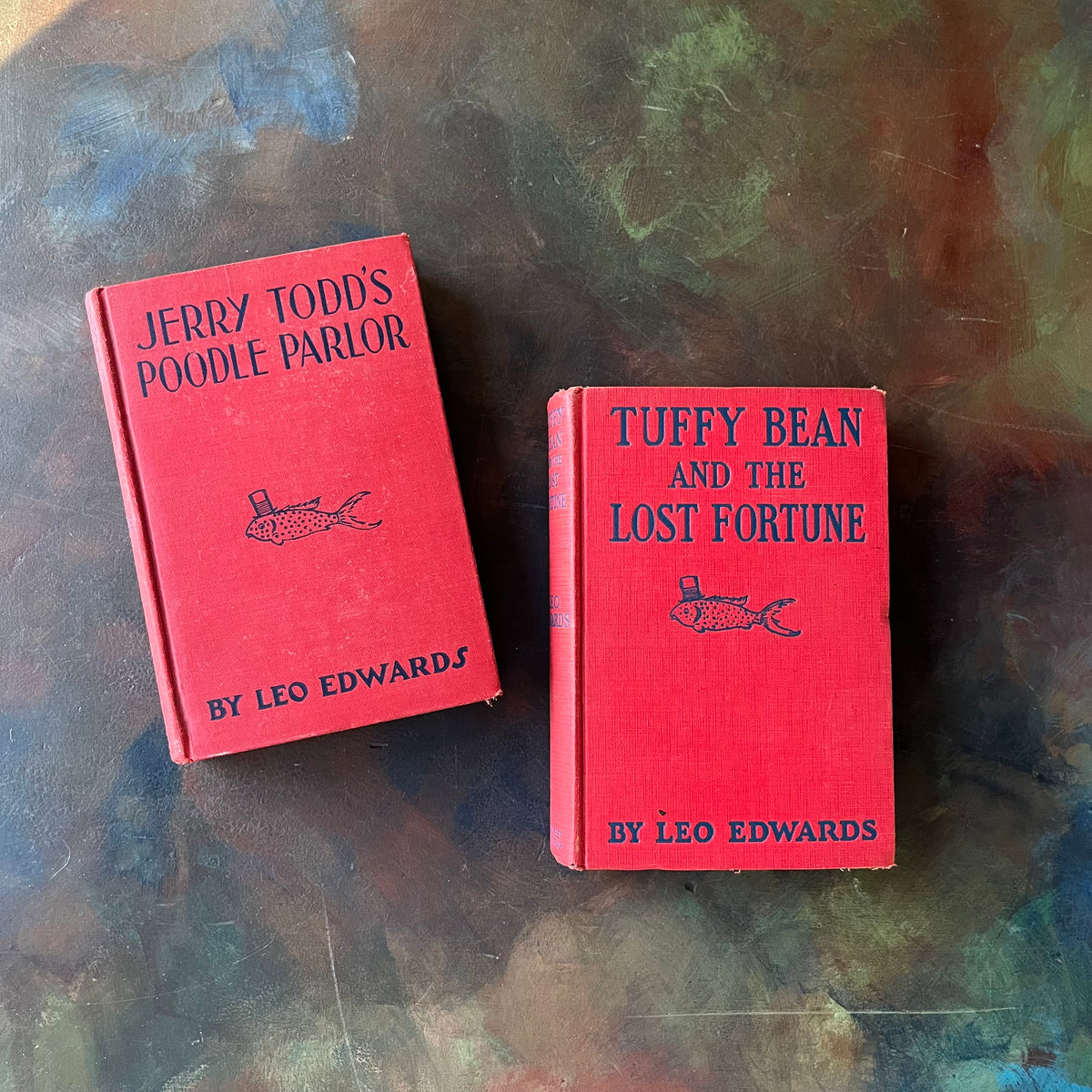 Pair of Leo Edwards Books-Tuffy Bean and the Lost Fortune-Jerry Todd's Poodle Parlor-vintage children's chapter books-view of the clothbound front covers in red & blue