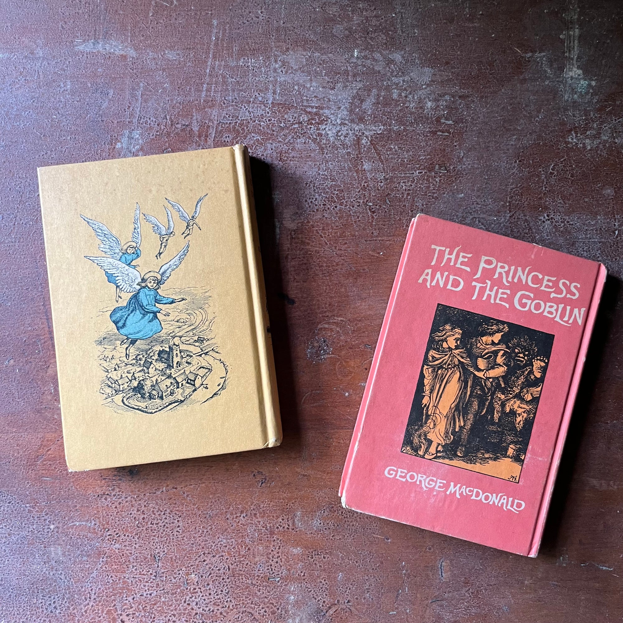 vintage children's chapter books - Pair of Looking Glass Library Books-The Princess and The Goblin written by George MacDonald and Five Children and It written by E. Nesbit - view of the colorful back covers with same images from the covers only larger