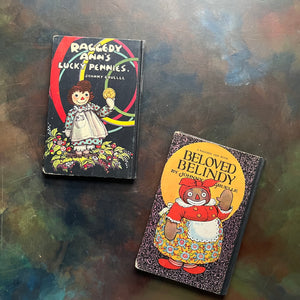 Pair of Raggedy Ann Books and Andy Books written by Johnny Gruelle-Raggedy Ann's Lucky Pennies-Beloved Belindy-classic children's books-view of the back covers