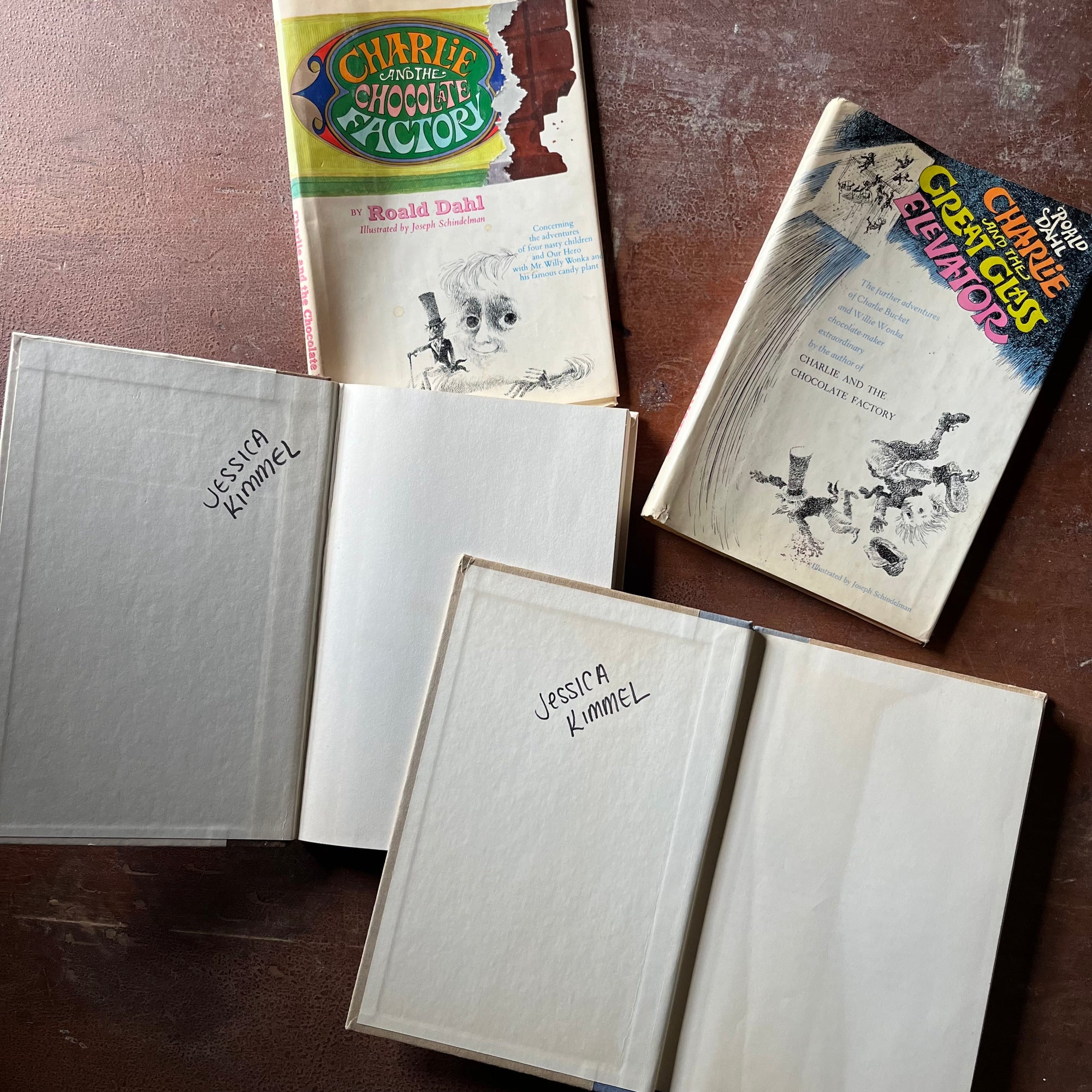 vintage children's chapter books - Pair of Roald Dahl Books-Charlie & The Chocolate Factory and Charlie & The Great Glass Elevator with illustrations by Joseph Schindelman - view of the inside covers with a name written in marker in both