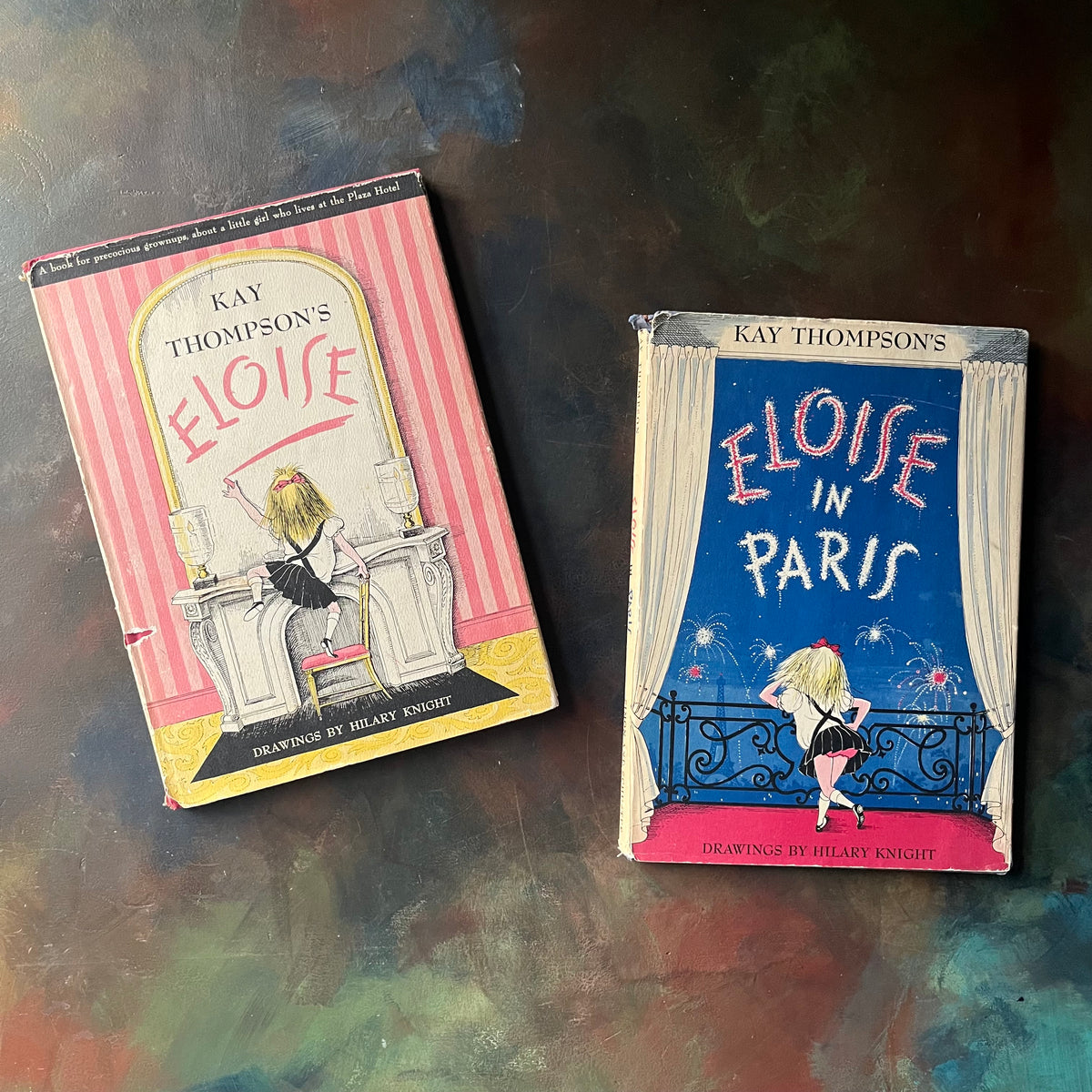 Pair of first edition Eloise Books by Kay Thompson-Eloise (6th Printing)-Eloise in Paris (3rd Printing)-Hilary Knight-vintage children's picture books-view of the dust jacket's front covers