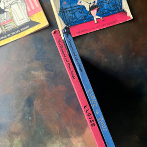 Pair of first edition Eloise Books by Kay Thompson-Eloise (6th Printing)-Eloise in Paris (3rd Printing)-Hilary Knight-vintage children's picture books-view of the spines