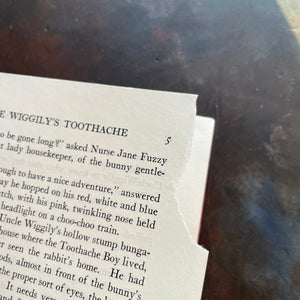 Pair of storybooks written by Howard R. Garis-Uncle Wiggily's Picture Book and Uncle Wiggily's Story Book-vintage children's chapter books-read aloud favorites-view of a page tear on page 5