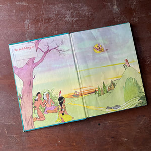 Peter Pan by J. M. Barrie with illustrations by Marjorie Torrey-A 1957 Random House Book-view of the inside cover with an illustration of tinker bell flying through the air with children dressed as indians & someone watching her from a hillside