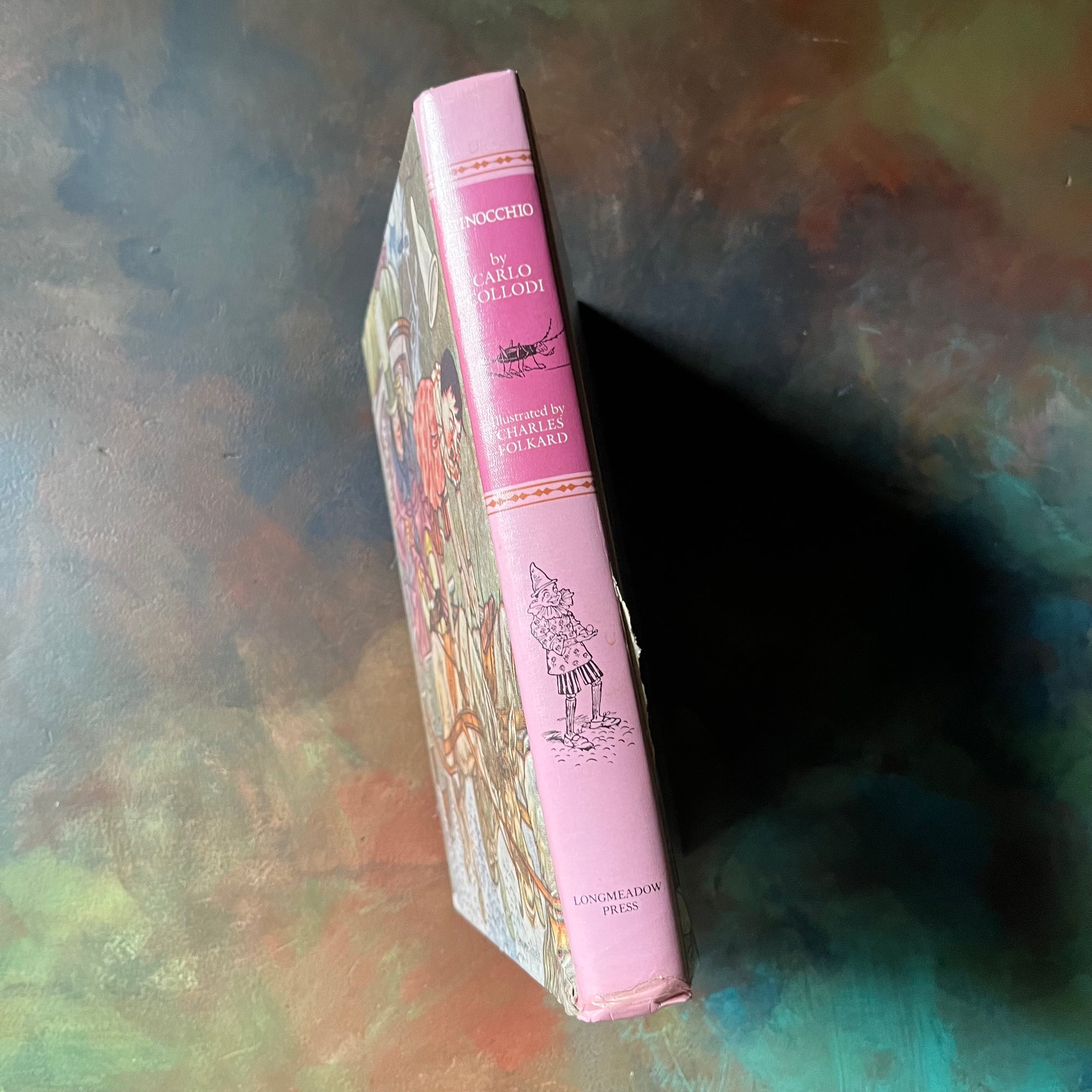 Pinocchio written by Carlo Collodi with illustrations by Charles Folkard-1987 Longmeadow Pres Edition-classic children's literature-vintage children's chapter book-view of the spine