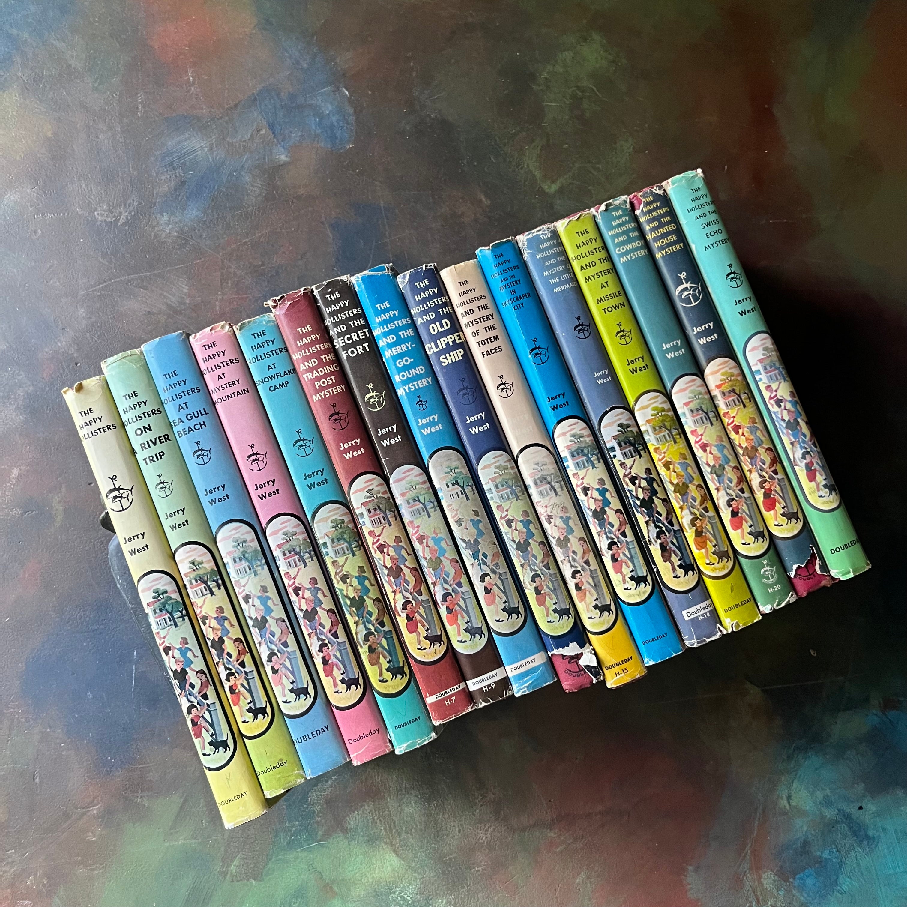 Set of 16 Happy Hollisters Mysteries written by Jerry West with illustrations by Helen S. Hamilton-vintage children's mystery books-wholesome books for children-view of the dust jacket's spines