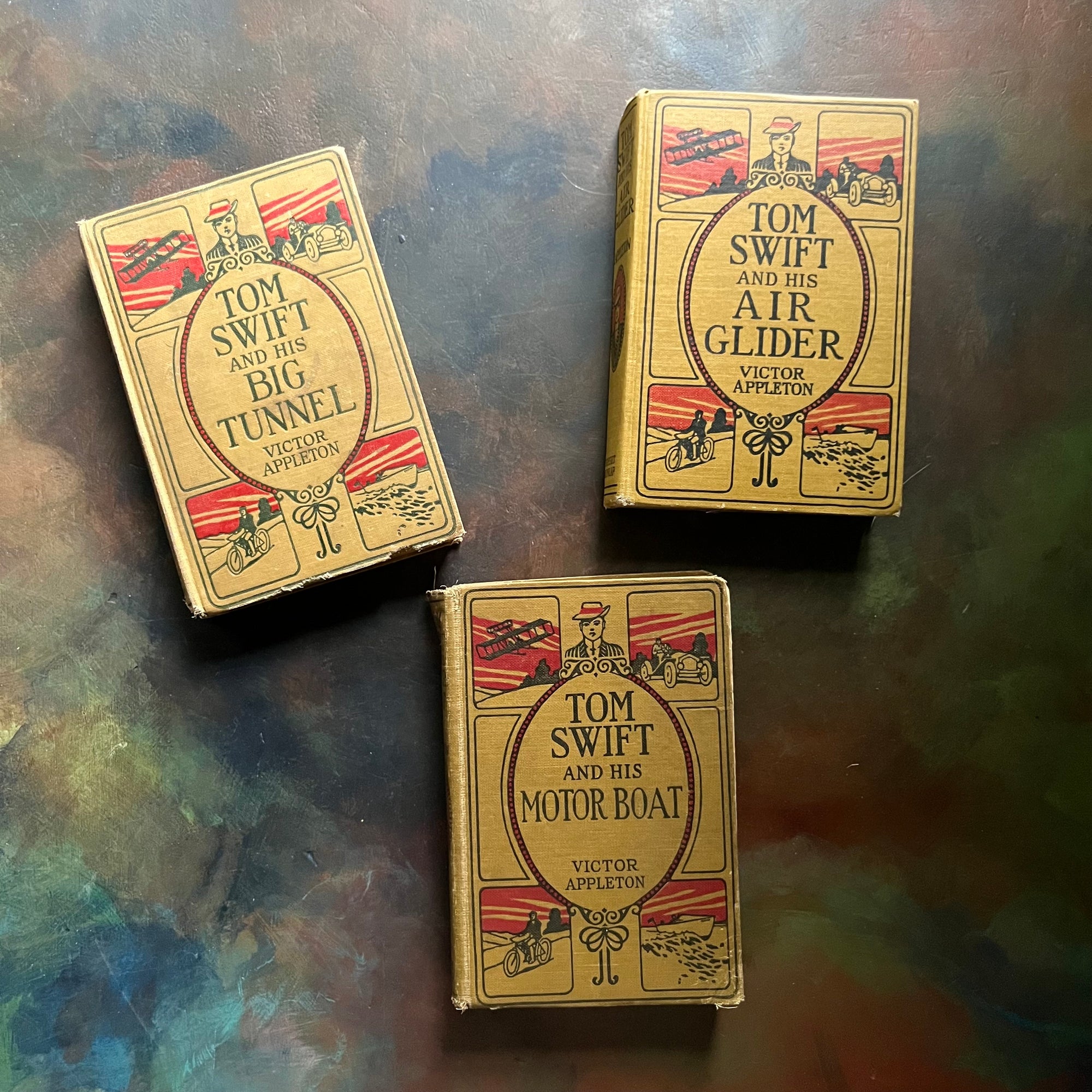 Set of Three Antique Adventure Books For Boys-Tom Swift and His Big Tunnel, Tom Swift & His Air Glider, and Tom Swift and His Motor Boat written by Victor Appleton-view of the front covers