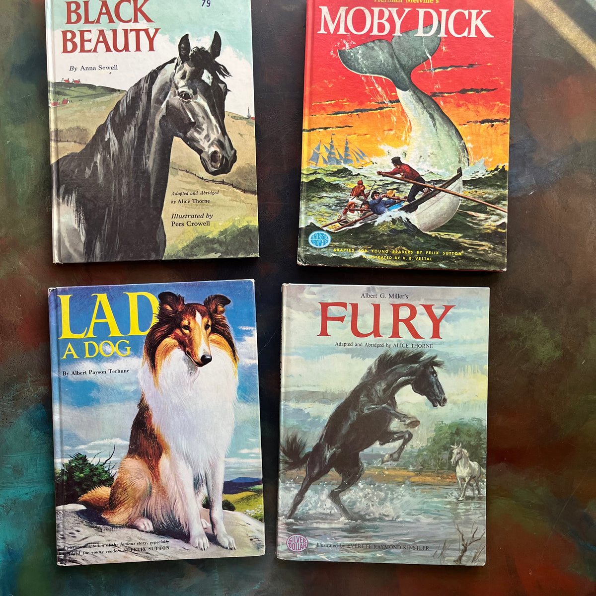 Set of 4 Classic Children's Early Chapter Books for Young Readers-Grosset Grow Up Series by Grosset & Dunlap Publishers - Black Beauty-Moby Dick-Fury-Lad a Dog-classic children's literature-view of the illustrated front covers