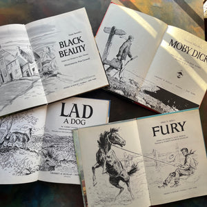 Set of 4 Classic Children's Early Chapter Books for Young Readers-Grosset Grow Up Series by Grosset & Dunlap Publishers - Black Beauty-Moby Dick-Fury-Lad a Dog-classic children's literature-view of the title pages with copyright information & illustrations noted