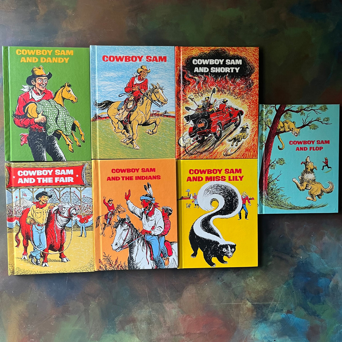 Set of 7 Cowboy Sam Books by Edna Walker Chandler with illustrations by Jack Merryweather-vintage early readers for Boys who love Cowboy stories-view of the front covers
