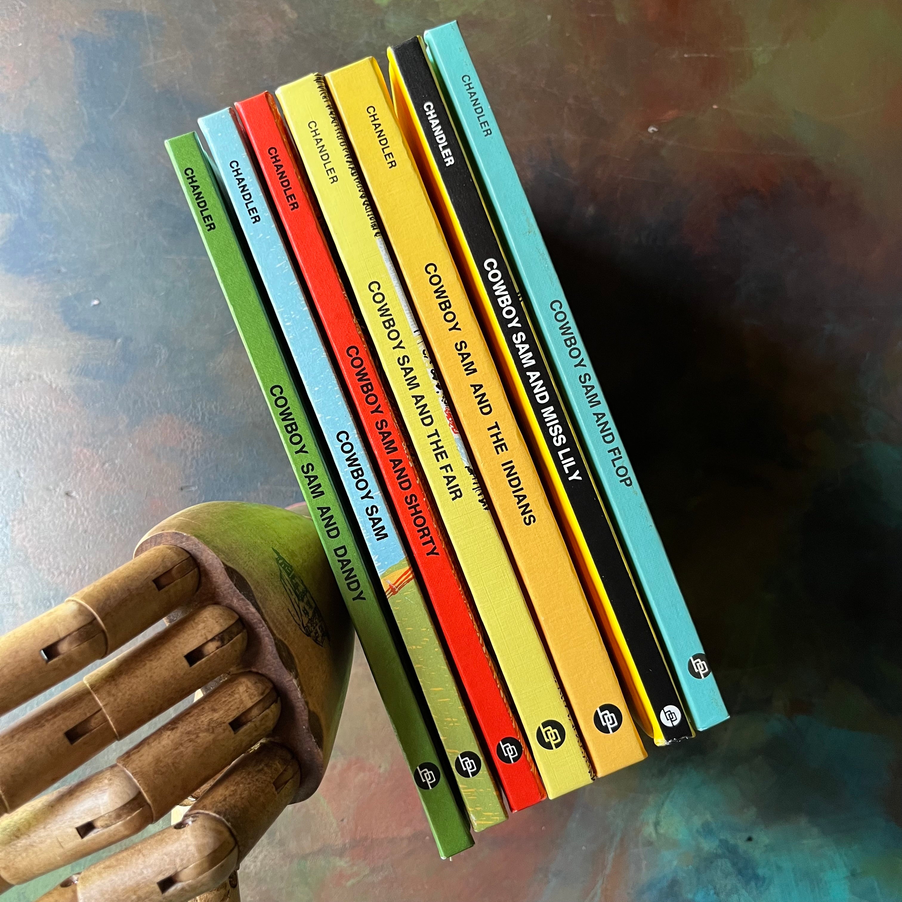 Set of 7 Cowboy Sam Books by Edna Walker Chandler with illustrations by Jack Merryweather-vintage early readers for Boys who love Cowboy stories-view of the spines