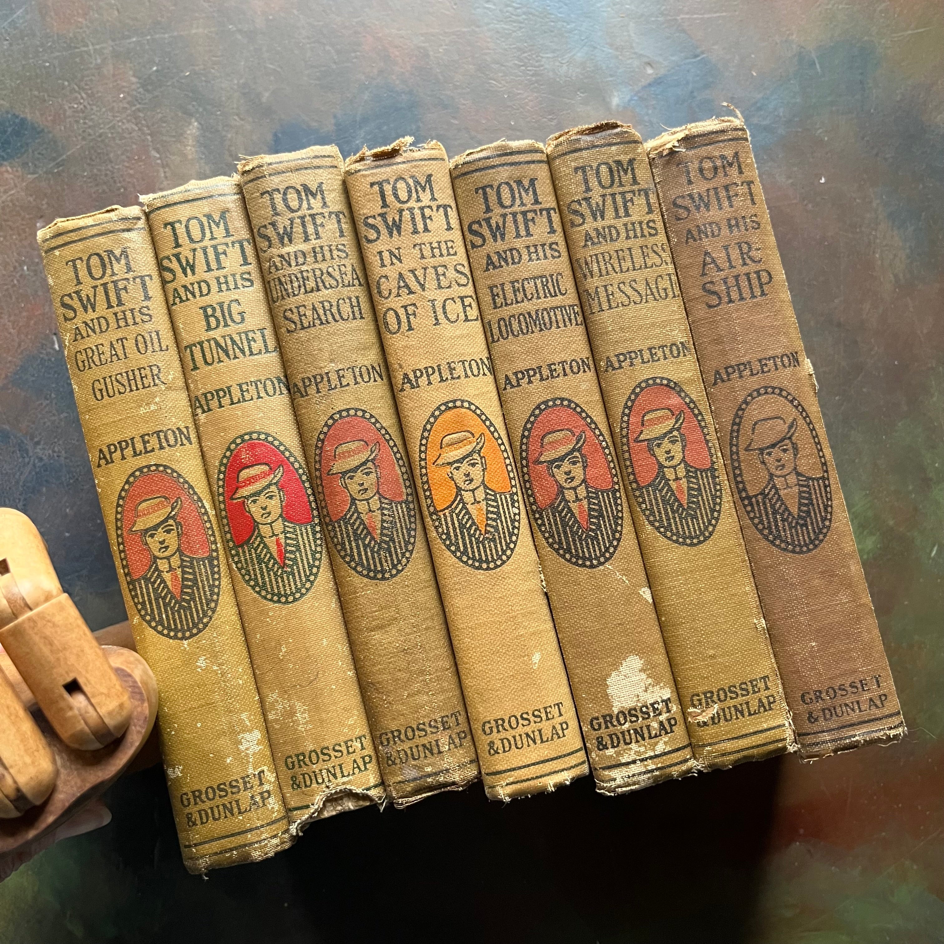 Set of 7 antique Tom Swift Books by Victor Appleton-sci fi books for boys-early 1900's adventure books for boys-view of the spines