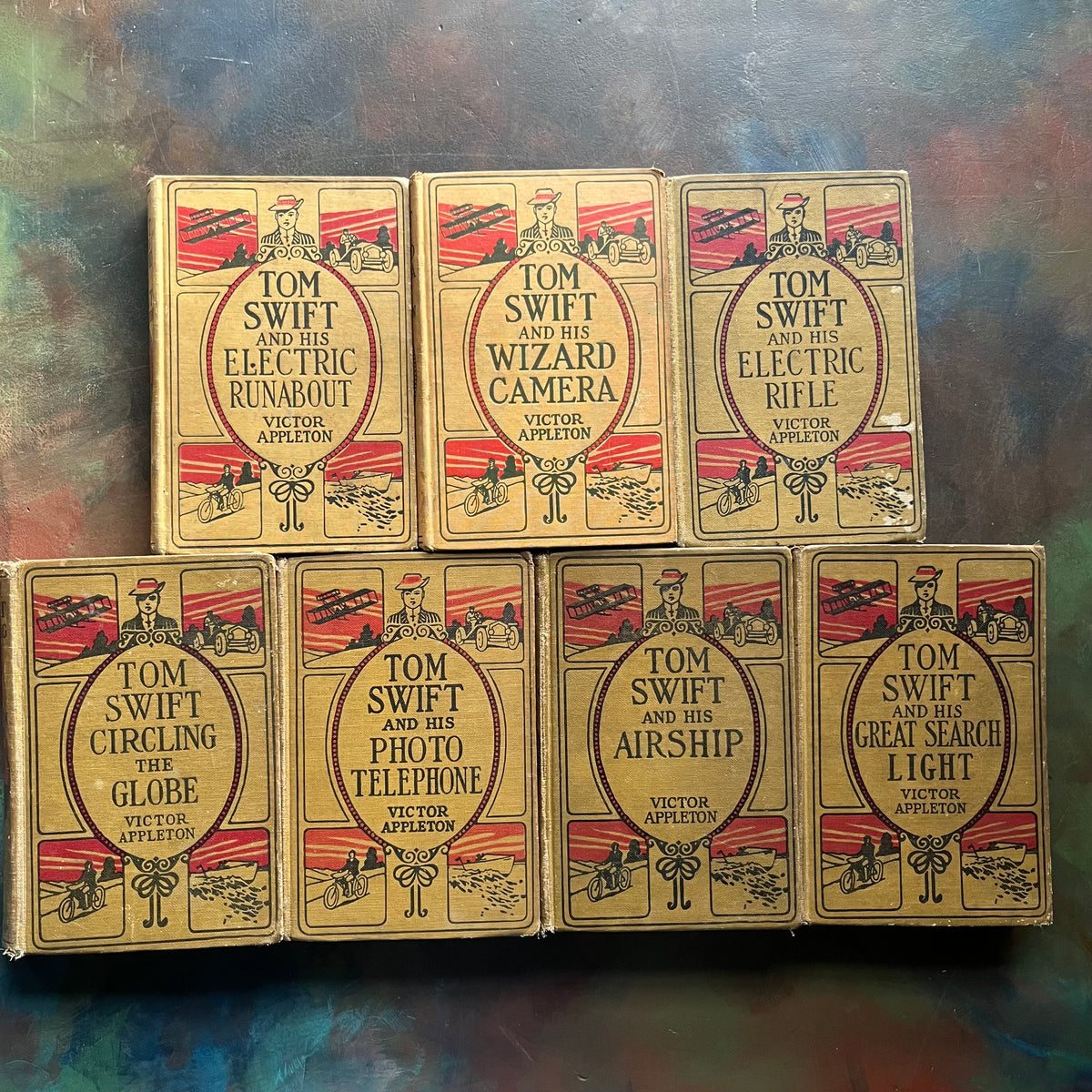 Set of 7 antique Tom Swift Books written by Victor Appleton-sci fi books for boys-early 1900's adventure books for boys-view of the front covers