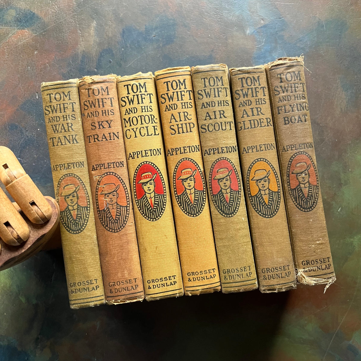 Set of 7 antique Tom Swift Books written by Victor Appleton-sci fi books for boys-early 1900's adventure books for boys-view of the spines