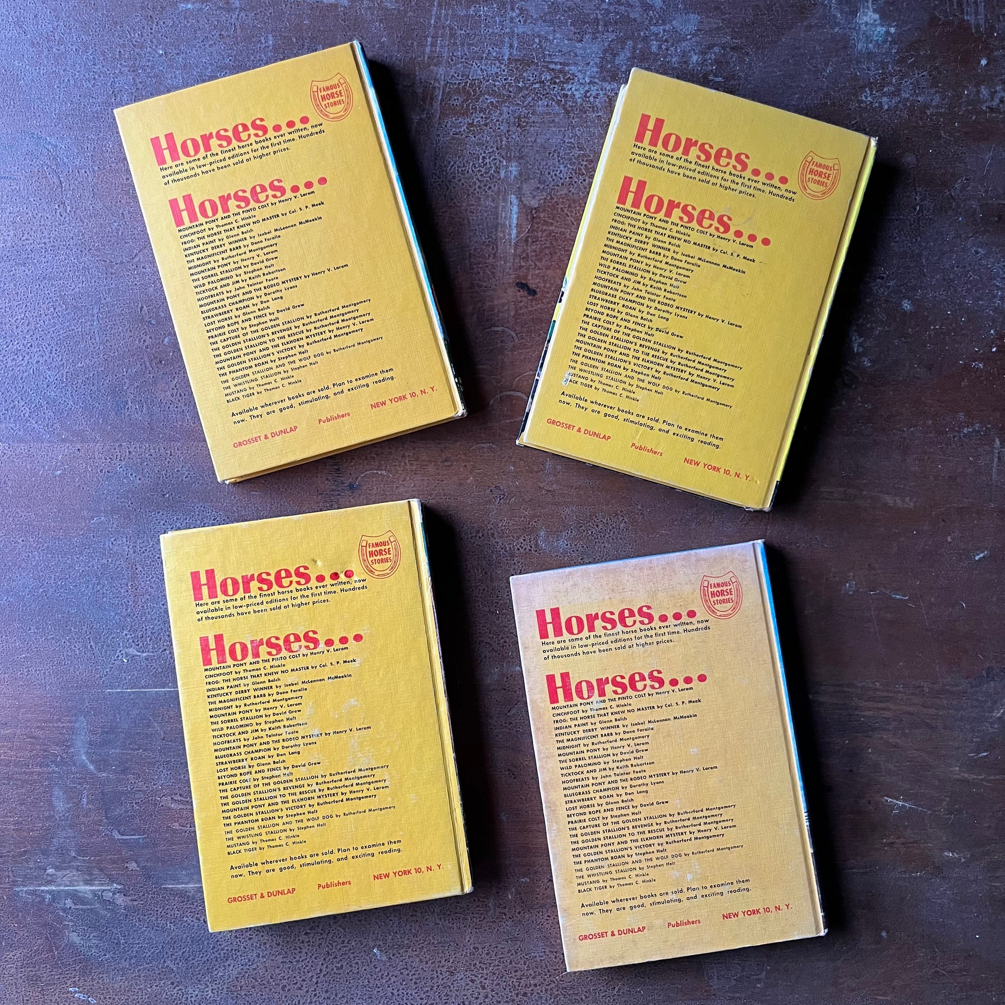 Set of Four Famous Horse Story Books-Mustang, Wild Palomino, Bleugrass Champion & Lost Horse-vintage children's chapter books-view of the back covers in an orangey yellow color with a list of the books in this series