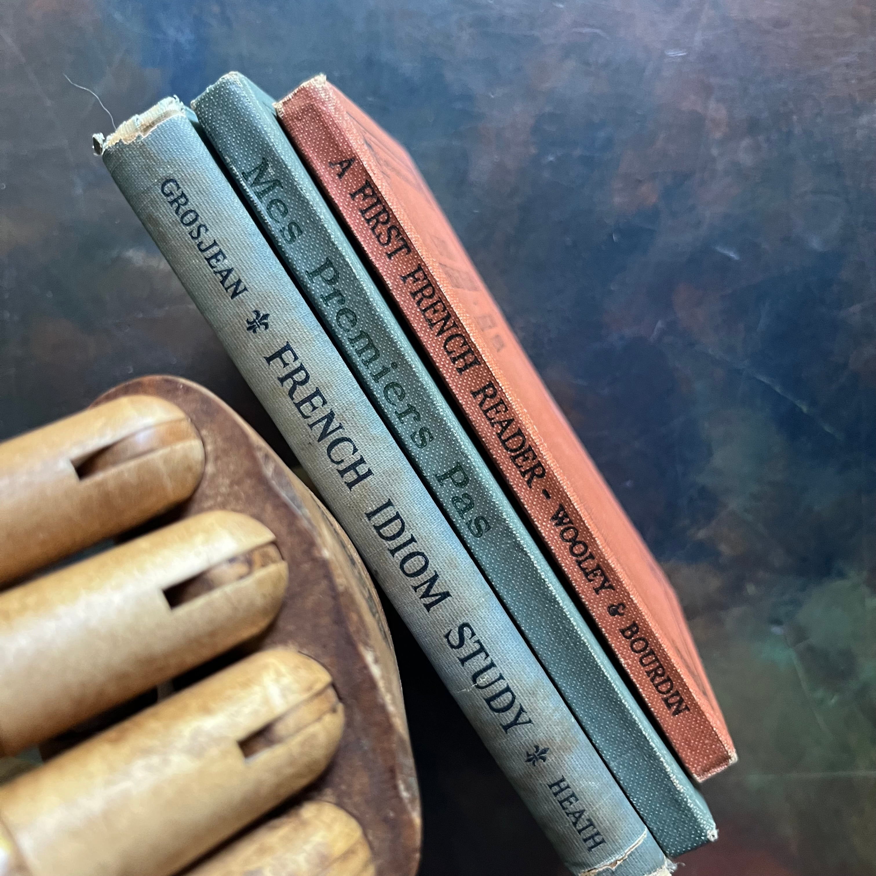 Set of Three Antique French Schoolbooks Teaching French-Idioms-French Primer-Learn French-Charlotte Mason Homeschool-Mes Premiers Pas en Francais-A First French Reader-French Idiom Study-view of the spines