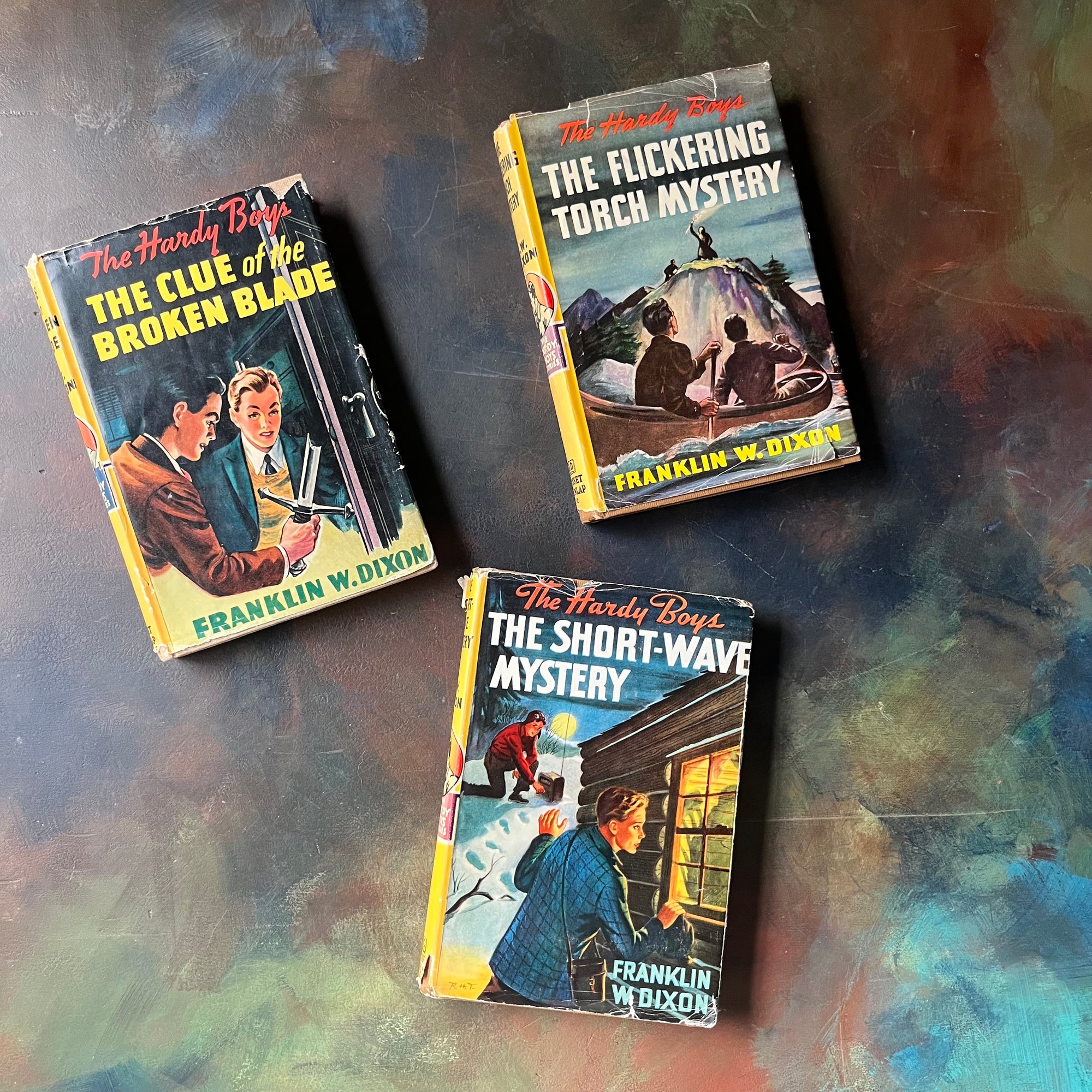 Set of Three Hardy Boys Mystery Books with Dust Jackets:  The Clue of the Broken Blade, The Flickering Torchlight Mystery and The Short-Wave Mystery-Franklin W. Dixon-vintage children's chapter books-vintage mysteries for young readers-view of the dust jacket's front covers