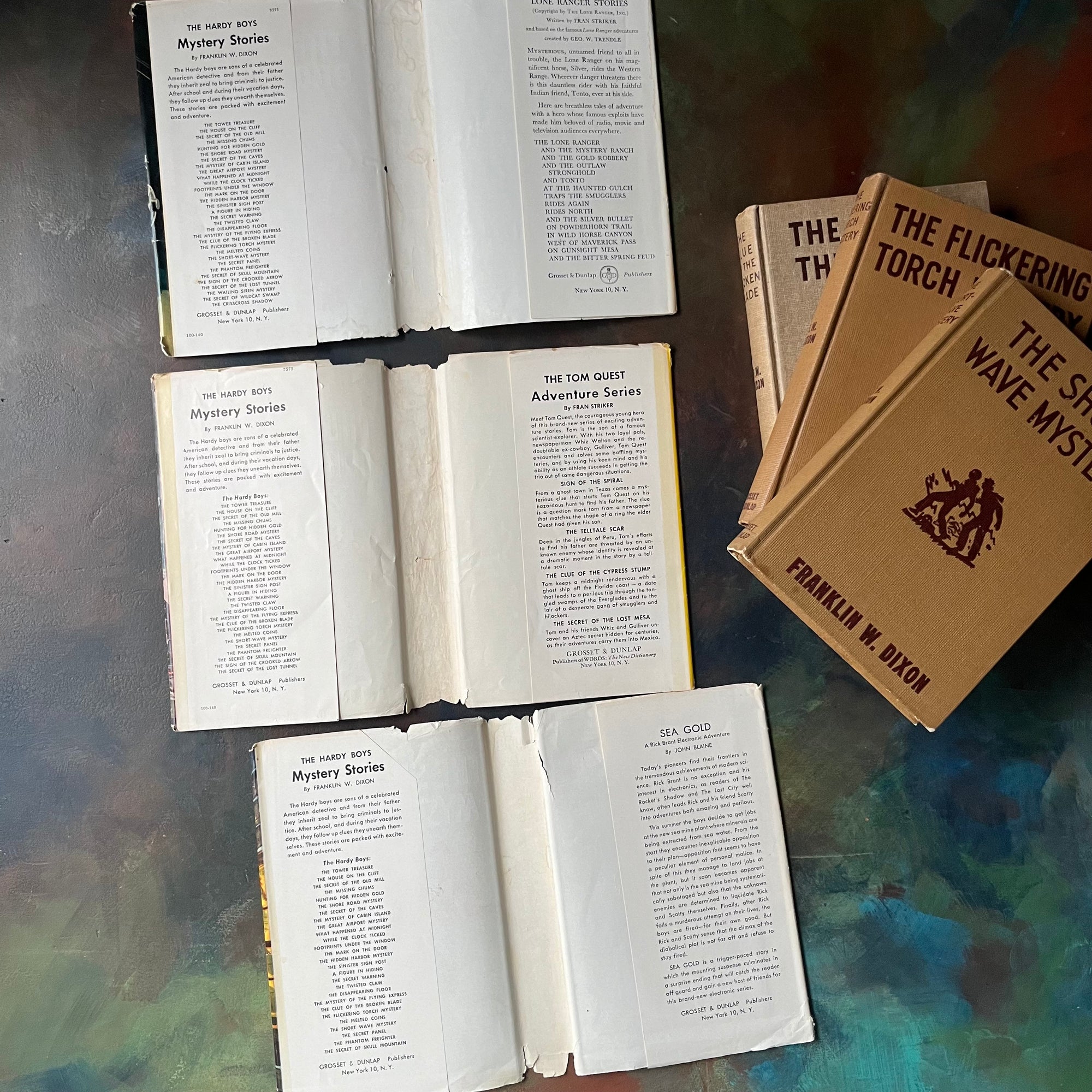 Set of Three Hardy Boys Mystery Books with Dust Jackets:  The Clue of the Broken Blade, The Flickering Torchlight Mystery and The Short-Wave Mystery-Franklin W. Dixon-vintage children's chapter books-vintage mysteries for young readers-view of the dust jacket's inside flaps
