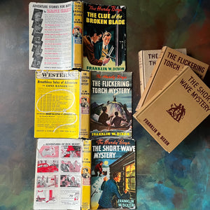 Set of Three Hardy Boys Mystery Books with Dust Jackets:  The Clue of the Broken Blade, The Flickering Torchlight Mystery and The Short-Wave Mystery-Franklin W. Dixon-vintage children's chapter books-vintage mysteries for young readers-view of the outside of the dust jackets
