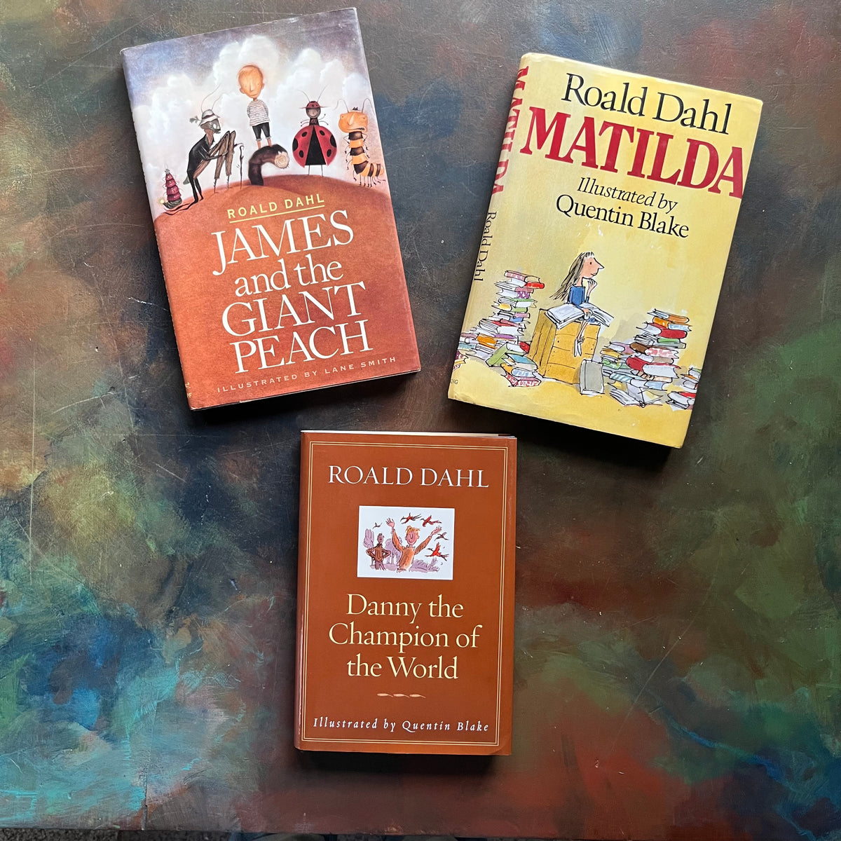 Set of Three Roald Dahl Books-Matilda-James and the Giant Peach-Danny the Champion of the World-children's chapter books-view of the dust jacket covers with images from each book plus the titles, author & illustrator