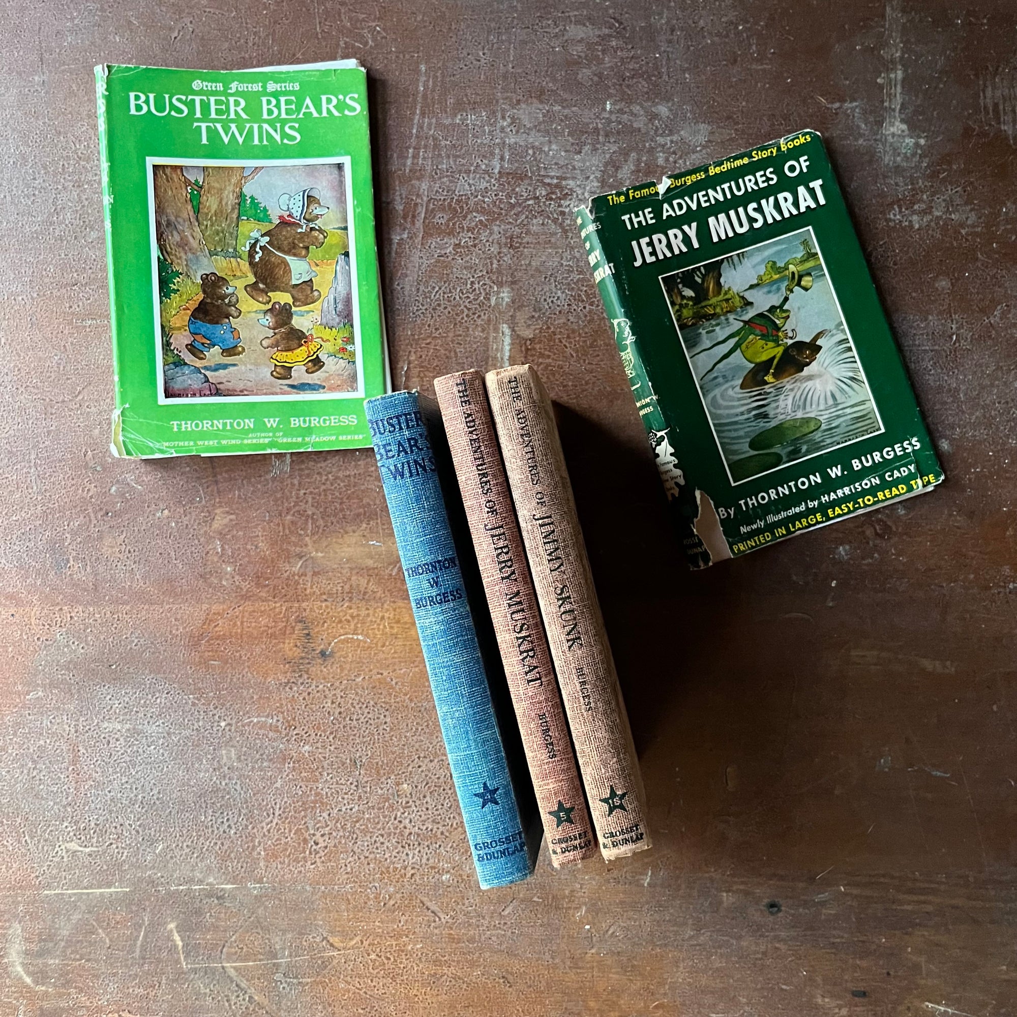 vintage children's chapter books, antiquarian books for children - Set of Three Thorton W. Burgess Books:  Buster Bears Twins, The Adventures of Jerry Muskrat, and The Adventures of Jimmy Skunk all illustrated by Harrison Cady - view of the spines