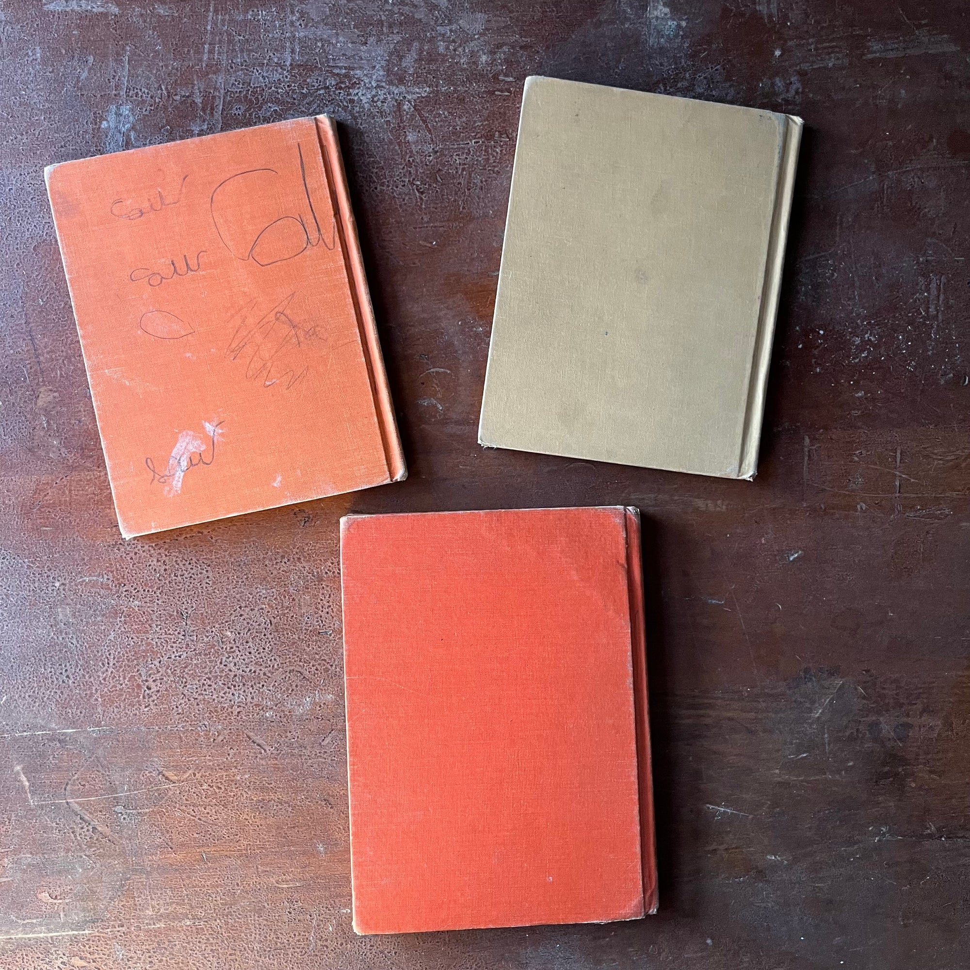 vintage children's early readers - Set of Three Vintage Cowboy Sam Books-Cowboy Sam & the Rodeo, Cowboy Sam & the Rustlers & Cowboy Sam and Shorty written by Edna Walker Chandler with illustrations by Jack Merryweather - view of the back covers - note the pencil drawings on the orange book