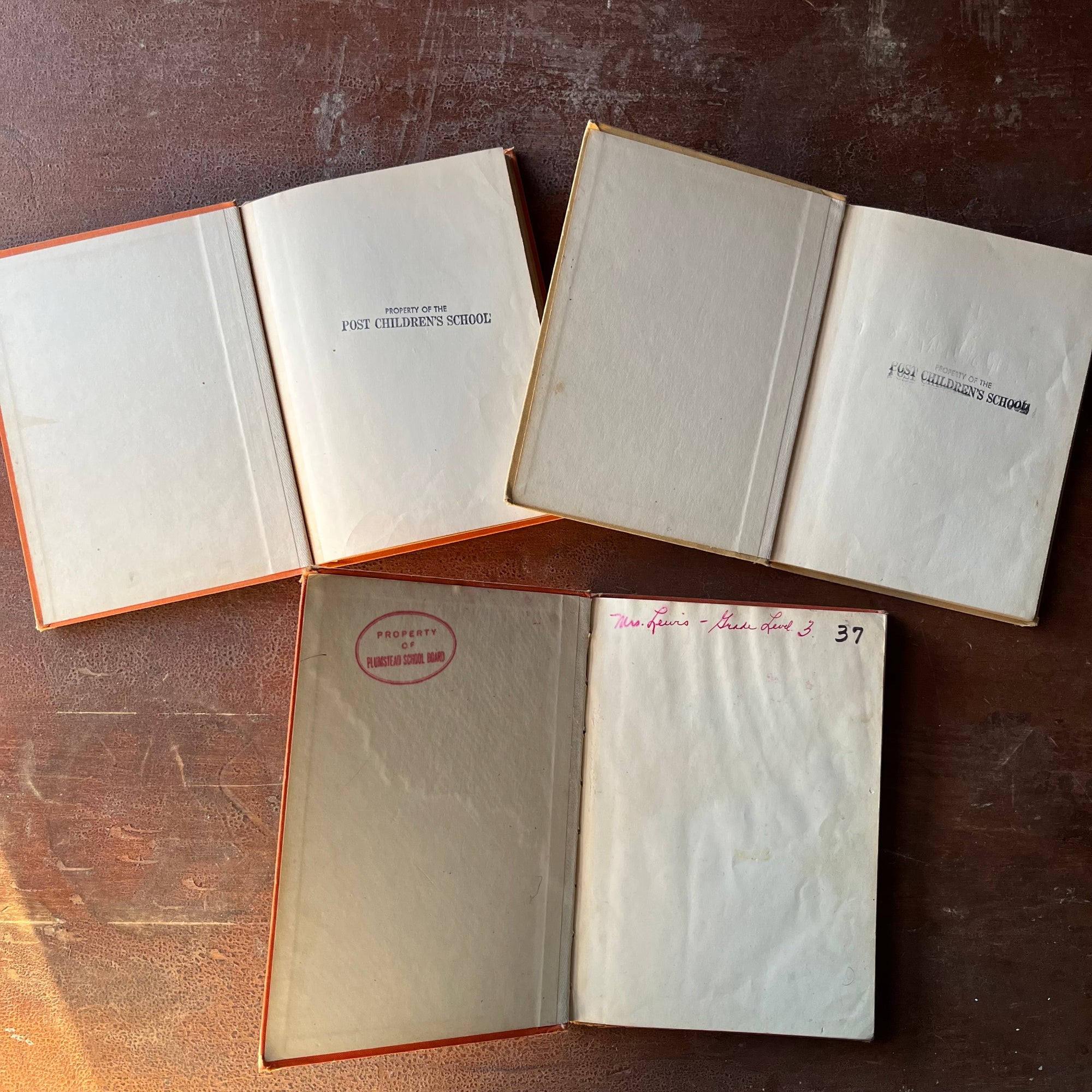 vintage children's early readers - Set of Three Vintage Cowboy Sam Books-Cowboy Sam & the Rodeo, Cowboy Sam & the Rustlers & Cowboy Sam and Shorty written by Edna Walker Chandler with illustrations by Jack Merryweather - view of the inside covers with school stamps & writing noted