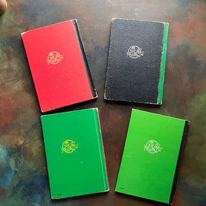 Set of four Raggedy Ann and Andy books written and illustrated by Johnny Gruelle-classic children's stories-heartwarming stories for children-view of the back covers