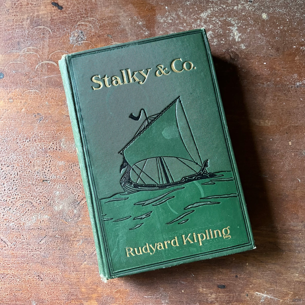 vintage children's chapter book, antique book - Stalky & Co. written by Rudyard Kipling 1899 Edition - view of the embossed front cover