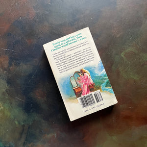 Sunfire Romance #7-Caroline by Willo Davis Roberts-vintage historical fiction-clean tween reading-view of the back cover with info on the book and an image of a girl sitting at a make-up table cutting off her long hair
