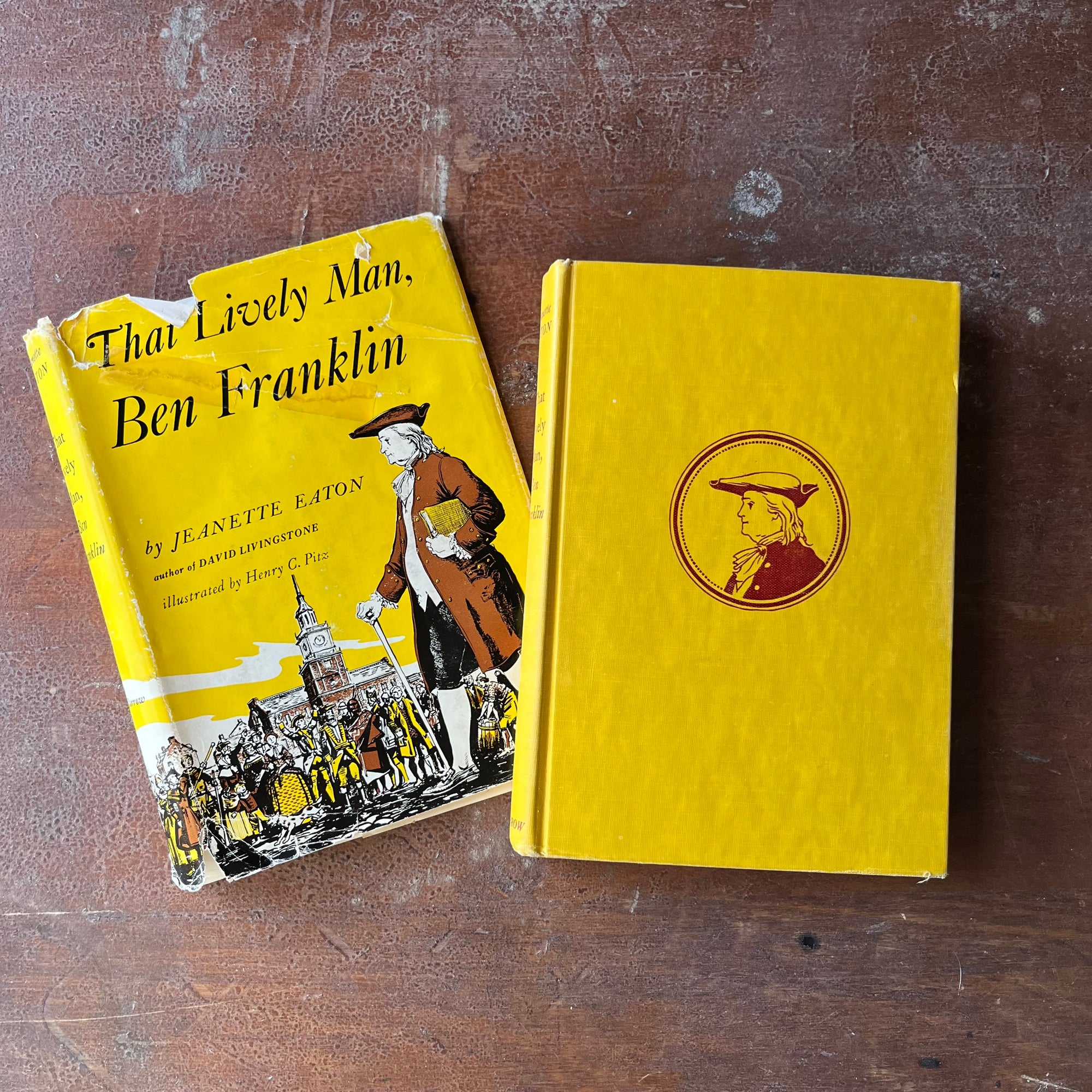 vintage children's chapter book-vintage living history book-That Lively Man, Ben Franklin written by Jeanette Eaton with illustrations by Henry C. Pitz-view of the dust jacket's front cover as well as the front cover of the book itself - both in bright yellow