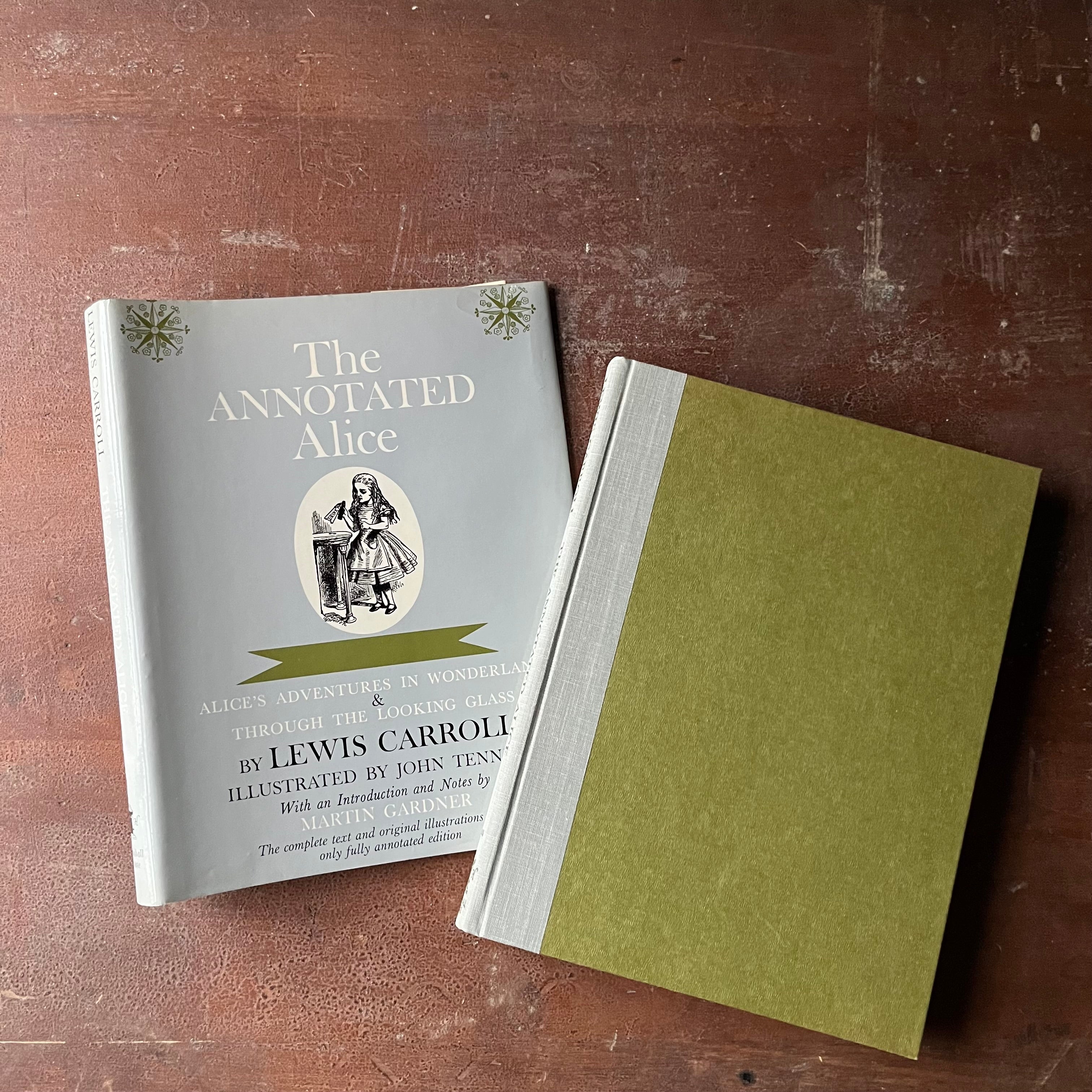 The Annotated Alice-Alice's Adventure's in Wonderland & Through the Looking Glass by Lewis Carroll-Notes by Martin Gardner-view of the front cover in green with a gray spine