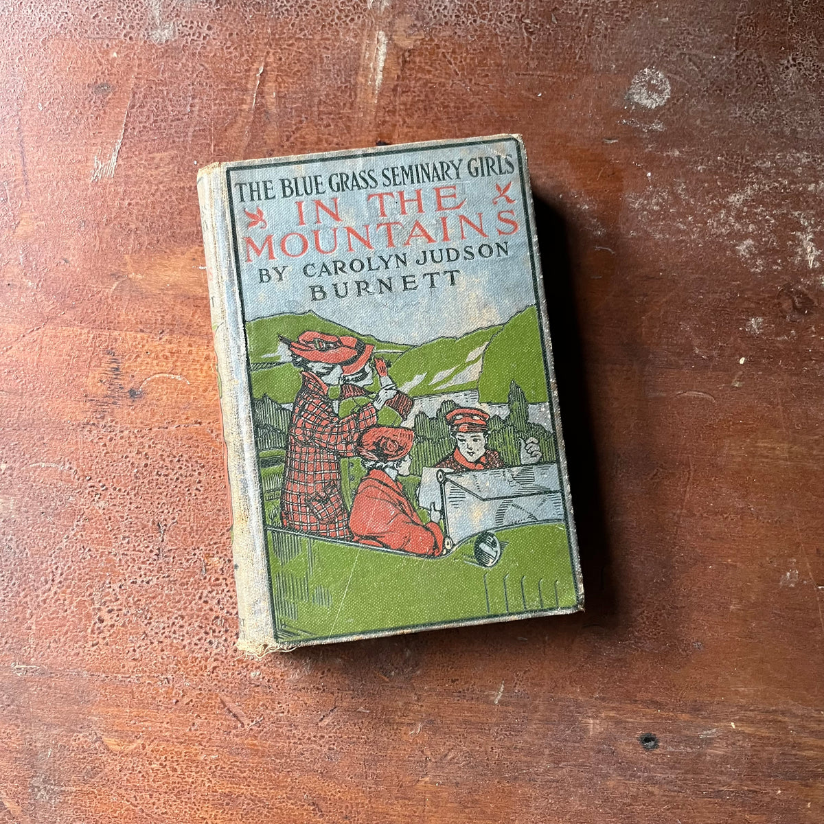 vintage children's chapter book, vintage adventure book for girls - The Blue Grass Seminary Girls In the Mountains written by Carolyn Judson Burnett - view of the embossed front cover