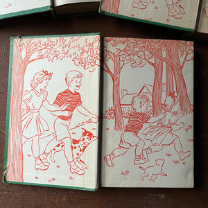 antique children's books , vintage children's chapter books, collectible books - The Bobbsey Twins Book Set-On The Deep Blue Sea, In a Great City and On a Houseboat written by Laura Lee Hope - view of the closeup of the inside cover with an illustration of four children in the woods with a dog & a cat & a house in the background.  