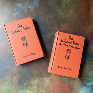 The Bobbsey Twins Two Book Set by Laura Lee Hope-Goldsmith Publishing Co.-vintage children's mystery books-view of the front covers in an orangey-brown & black