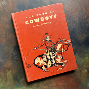 The Book of Cowboys written & illustrated by Holling C. Holling-living book-wild west-cowboy history-US expansion west-living history book-view of the front cover depicting a cowboy riding a paint horse