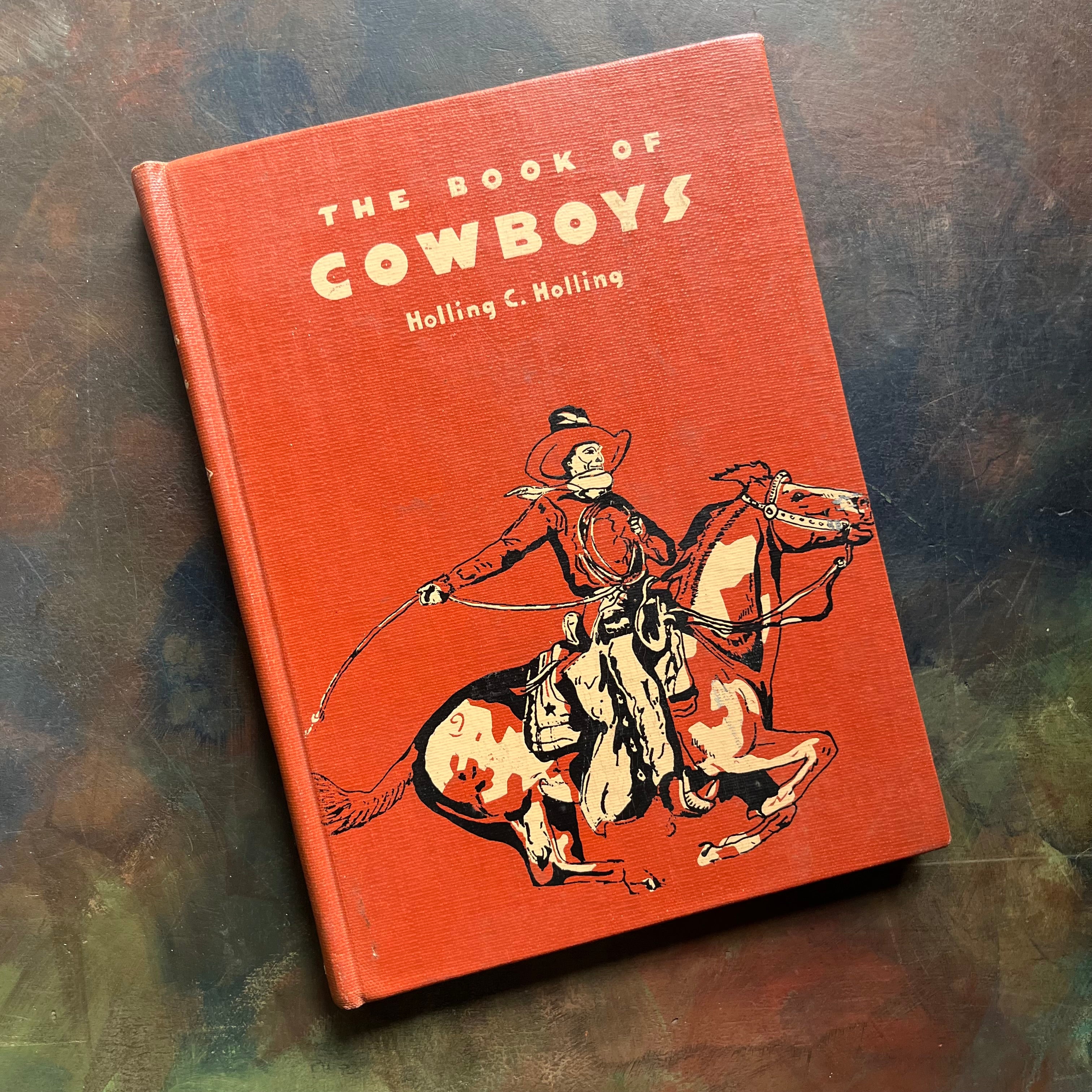 The Book of Cowboys written & illustrated by Holling C. Holling-living book-wild west-cowboy history-US expansion west-living history book-view of the front cover depicting a cowboy riding a paint horse