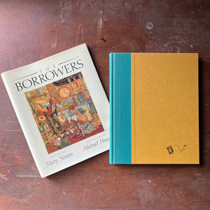 vintage children's chapter book, classic children's story, modern children's book edition - The Borrower's written by Mary Norton with illustrations by Michael Hague - view of the embossed front cover in bright yellow with a blue edge at the binding
