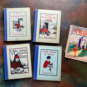 The Children of All Lands Stories-Little Indian Weaver-The Little Dutch Tulip Girl-Little Anne of Canada-Little Jeanne of France-living history books-view of the front covers depicting characters from the books