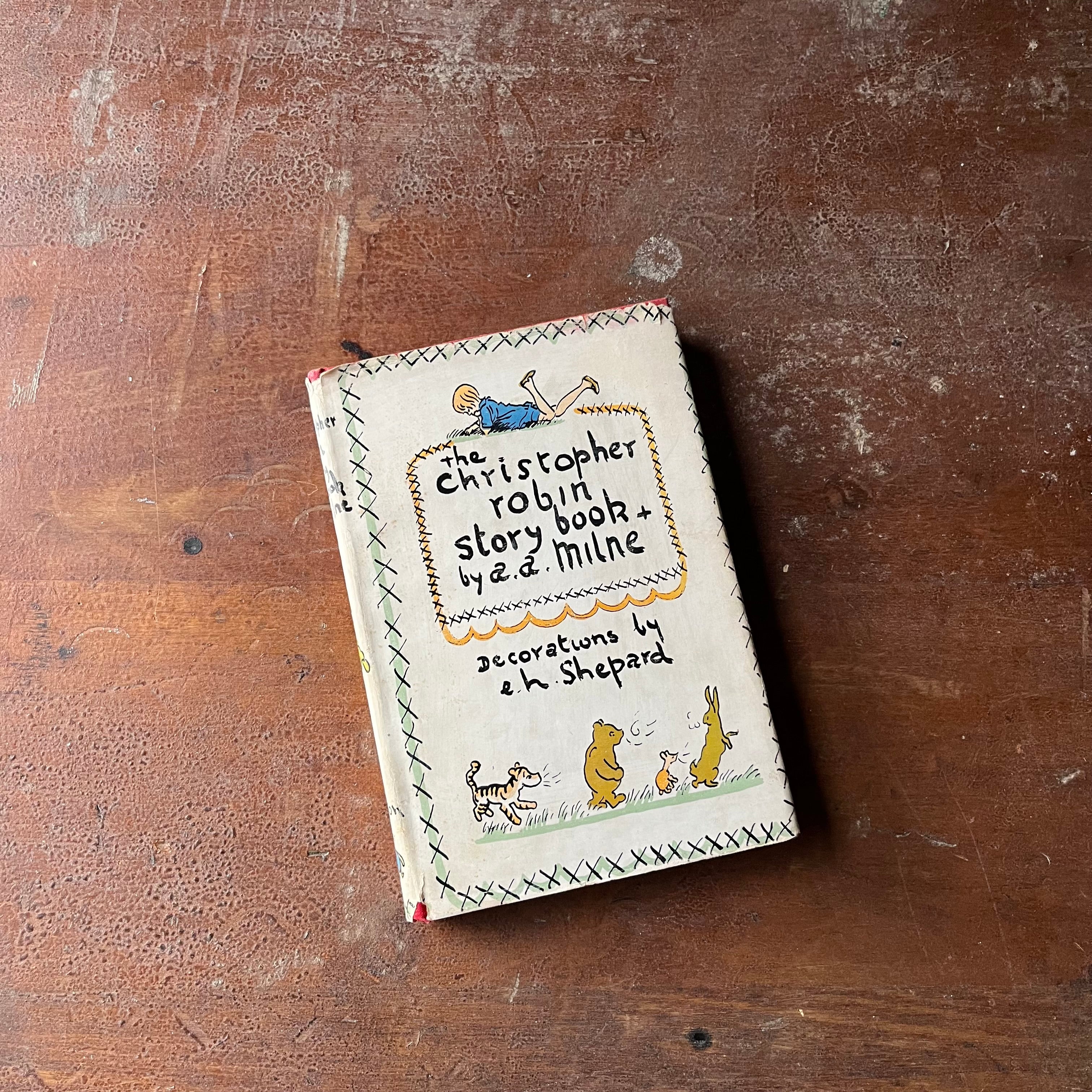 vintage children's story book - The Christopher Robin Story Book written by A. A. Milne with Decorations (illustrations) by E. H. Shepard - hardcover edition with dust jacket - view of the dust jacket's front cover